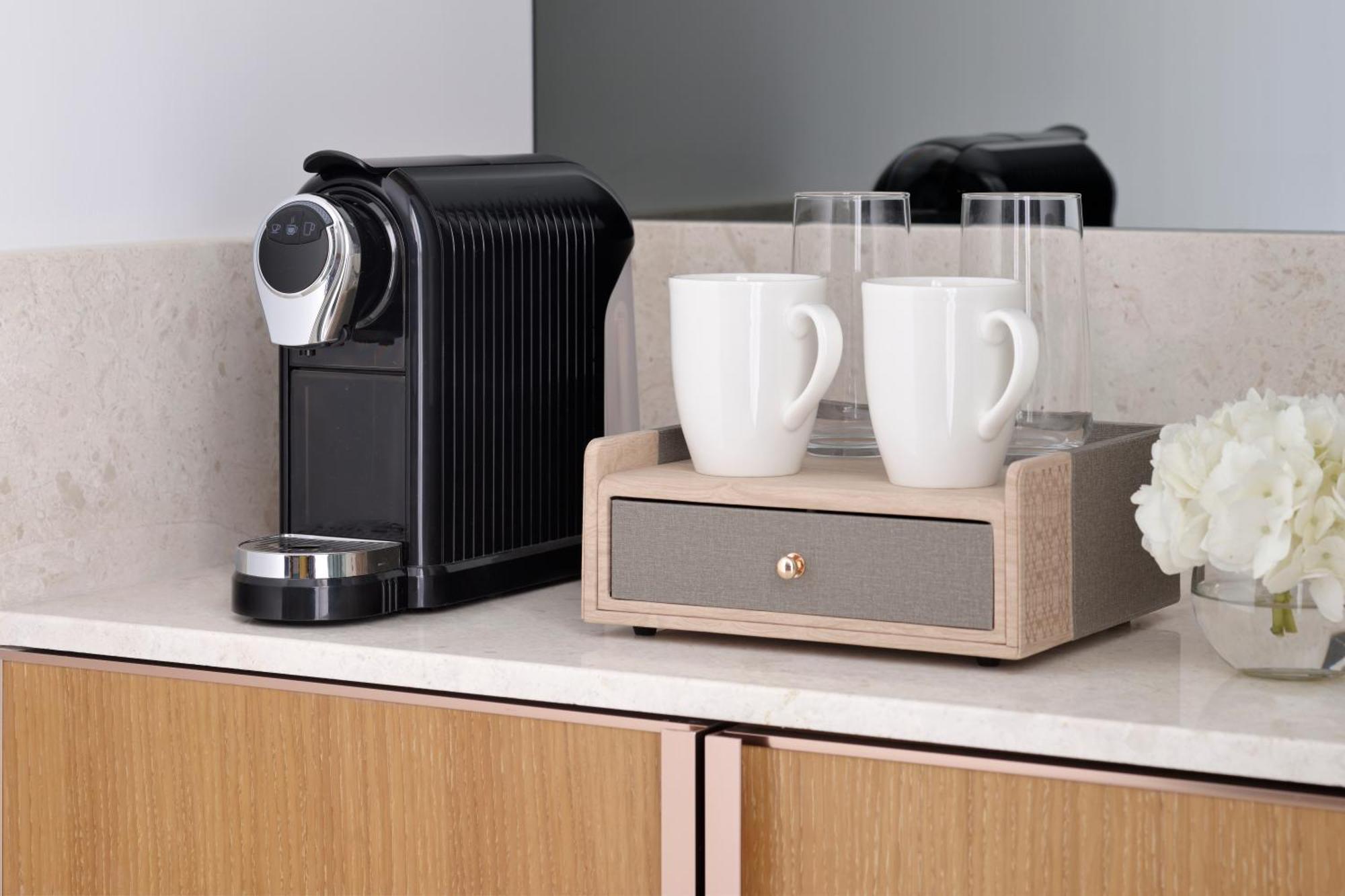 Moevenpick Hotel & Apartments Ghala Mascate Exterior foto A Nespresso coffee machine