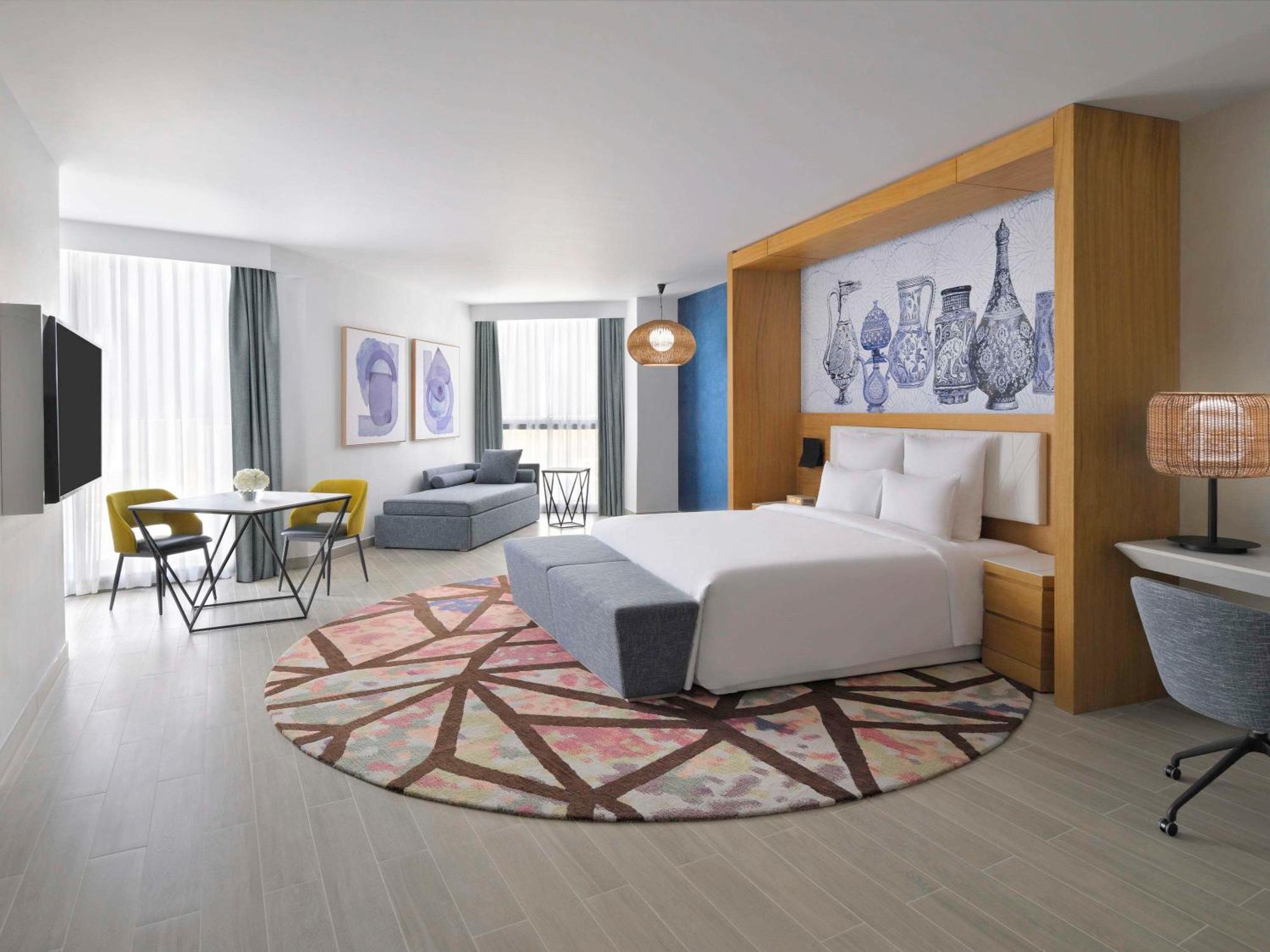 Moevenpick Hotel & Apartments Ghala Mascate Exterior foto A room at the hotel